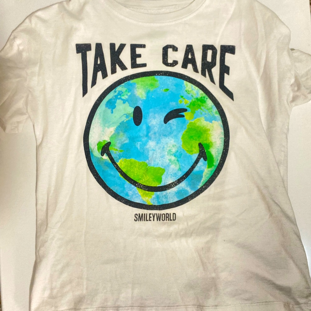 Target graphic T- shirt with earth print on it “take care”.